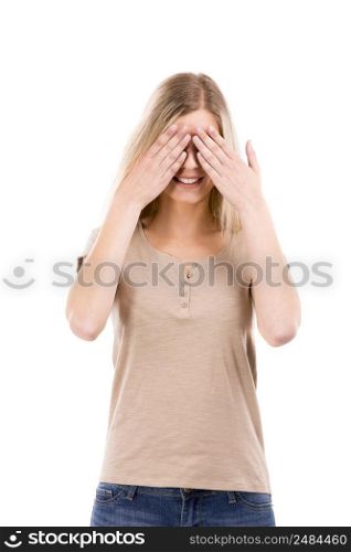 Beautiful blonde woman covering her eyes with her hans, isolated over white background