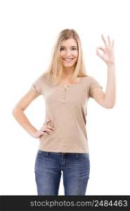 Beautiful blonde woman doing a Okay sign with her hand, isolated over white background
