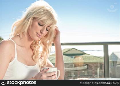 beautiful blonde woman having coffee in a restaurant
