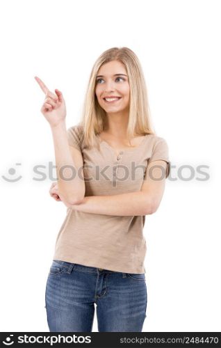 Beautiful blonde woman laughing and pointing to the left, isolated over white background