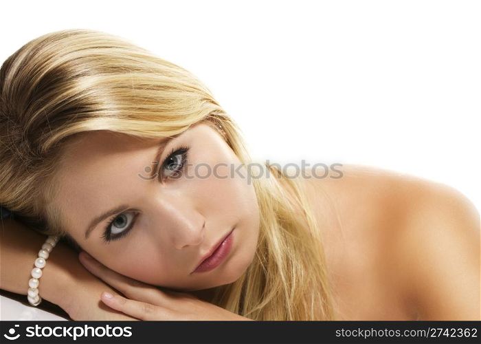 beautiful blonde woman laying her head on a table. beautiful blonde woman laying her head on a table on white background