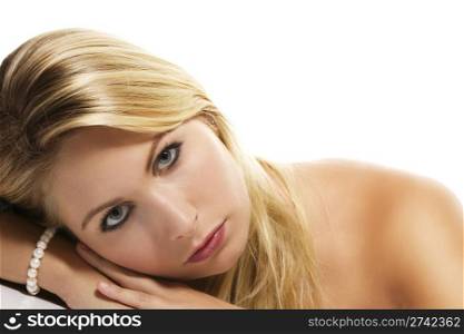 beautiful blonde woman laying her head on a table. beautiful blonde woman laying her head on a table on white background
