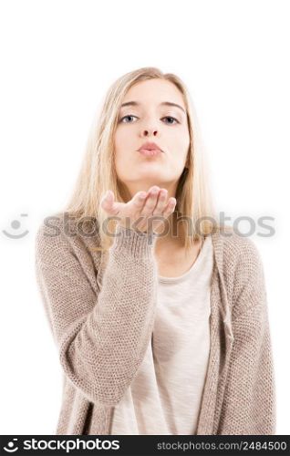 Beautiful blonde woman looking to the camera and sending a kiss