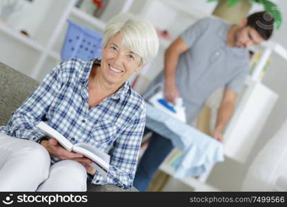 beautiful blonde woman reading a book