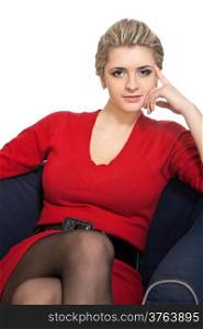 Beautiful blonde woman sitting on arm chair