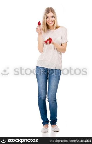 Beautiful blonde woman smiling and holding strawberries, isolated over white background