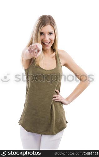 Beautiful blonde woman smiling and pointing to the camera, isolated over white background