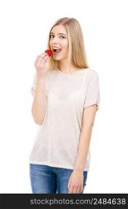 Beautiful blonde woman tasting a strawberrie, isolated over white background