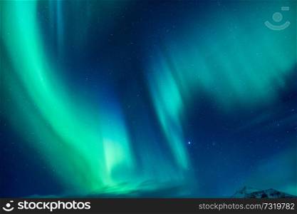 Beautiful blue and green Northern light, abstract natural background, magic paranormal light in the night starry sky, beautiful nature of Iceland