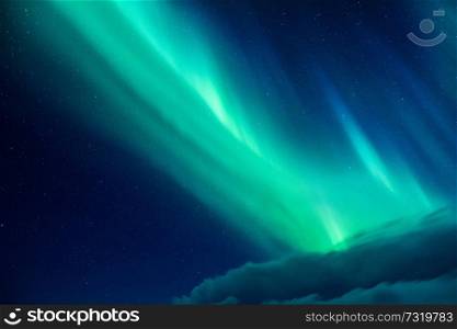 Beautiful blue and green Northern light, abstract natural background, magic paranormal light in the night starry sky, beautiful nature of Iceland
