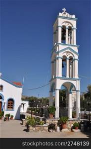 beautiful blue and white church tower in Pserimos island, Greece (gorgeous blue sky)