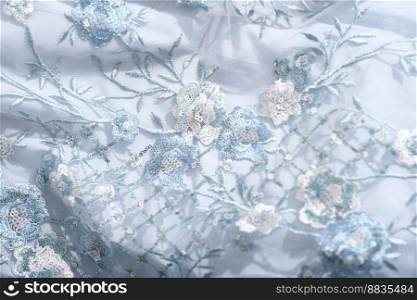 beautiful blue color lace fabric with sequins and embroidery. textile for party dress or prom dress. wedding bridal gown details sewing. beautiful blue color lace fabric with sequins and embroidery. textile for party dress or prom dress. wedding outfit sewing.