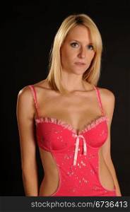 Beautiful blue eyed blonde in a pink baby doll