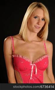 Beautiful blue eyed blonde in a pink baby doll