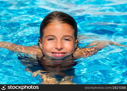 beautiful blue eyes kid girl at the pool with face in water surface