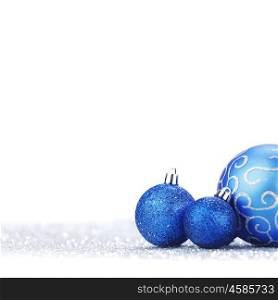 Beautiful blue Glitter christmas balls close-up on shining background