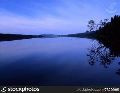 Beautiful blue lake reflection in the evening