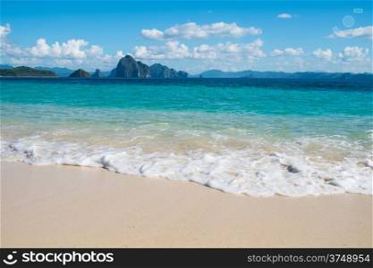 Beautiful blue sea wave on white sand beach