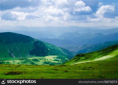 Beautiful blue sky and glade high up in Carpathian mountains. Beautiful mountain landscape