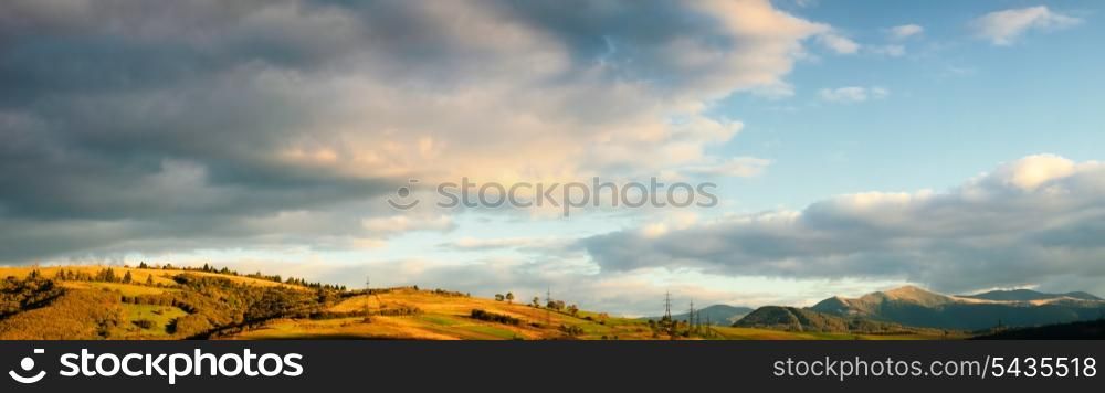 Beautiful blue sky and green grass and fields in Carpathian mountains