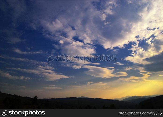Beautiful blue sky and sundown Carpathian mountains