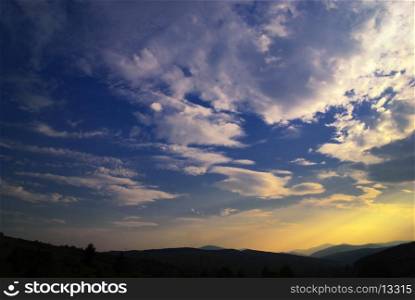 Beautiful blue sky and sundown Carpathian mountains