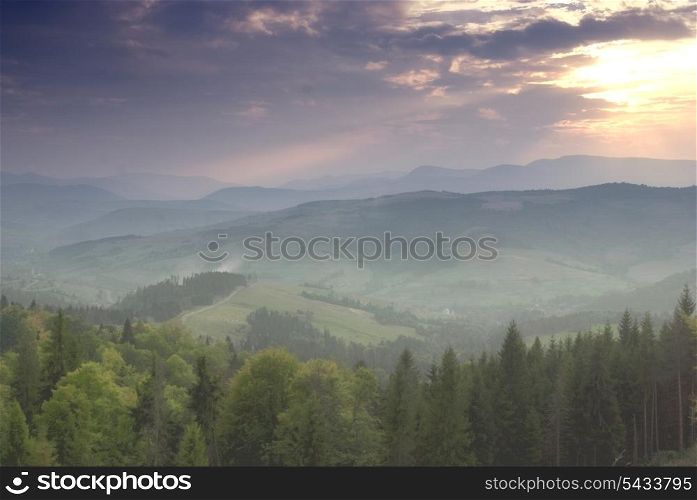 Beautiful blue sky and sundown Carpathian mountains after the rain.