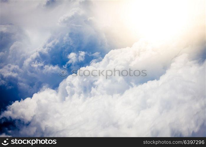 Beautiful blue sky with fluffy clouds. Bright light of heaven. Walk to the heaven
