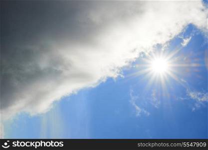 Beautiful blue sky with sun and clouds