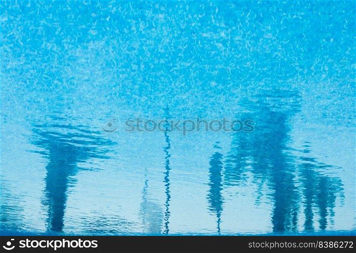 Beautiful blue water background with abstract reflections.