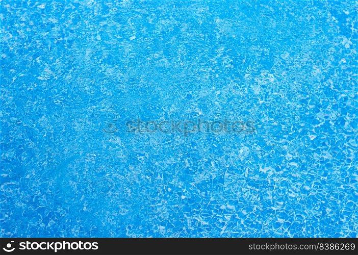 Beautiful blue water surface with tiny waves and ripples.