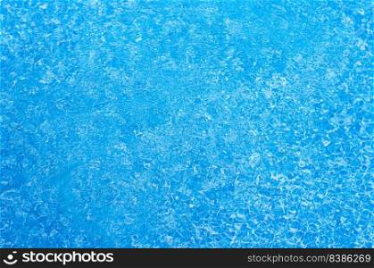 Beautiful blue water surface with tiny waves and ripples.