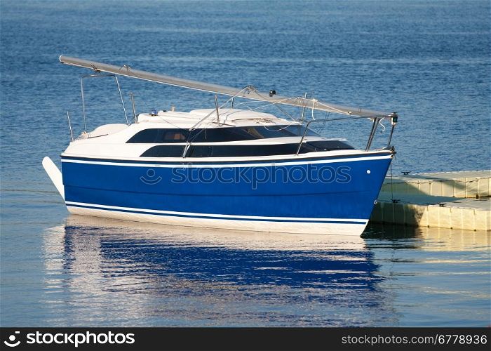 Beautiful blue yacht in harbor