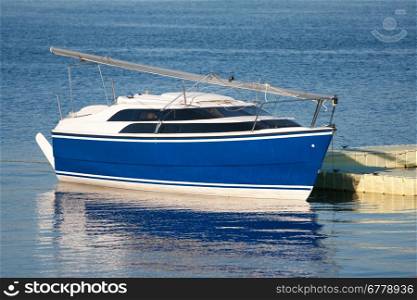 Beautiful blue yacht in harbor