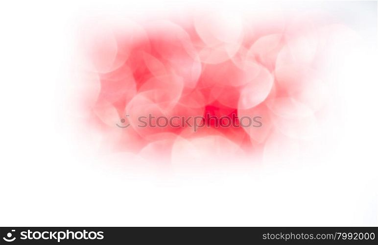 Beautiful bokeh red lights on the white background. Beautiful defocused red lights on the white background