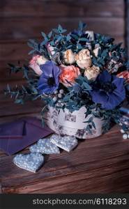 beautiful bouquet flowers and hearts . beautiful bouquet flowers and hearts at wooden background