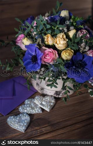 beautiful bouquet flowers and hearts . beautiful bouquet flowers and hearts at wooden background