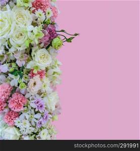 Beautiful bouquet flowers of white Roses, pink Orchid, pink Carnation and white Chrysanthemum on pink background