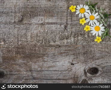 Beautiful bouquet of blooming, bright flowers lying on unpainted boards. Place for your inscription. Top view, close-up. Congratulations to loved ones, family, relatives, friends and colleagues. Beautiful bouquet of blooming, bright flowers. Close-up.