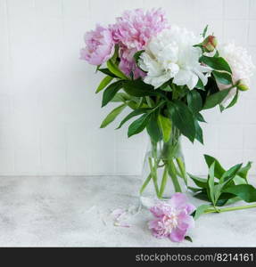 Beautiful bouquet of flowers: white and pink  peonies in a vase
