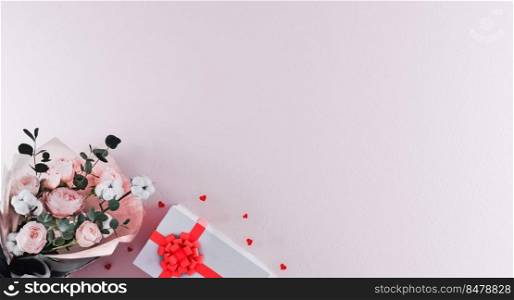 Beautiful bouquet of flowers with white gift box with red ribbon and heart shaped confetti on light pink background. Valentine’s Day, Birthday concept. Beautiful romantic background. 3d rendering