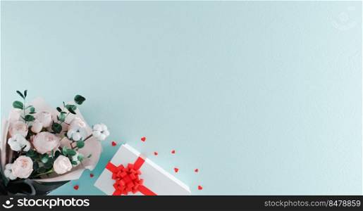 Beautiful bouquet of flowers with white gift box with red ribbon and heart shaped confetti on light blue background. Valentine’s Day, Birthday concept. Beautiful romantic background. 3d rendering