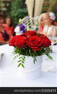 beautiful bouquet of red roses in white vase