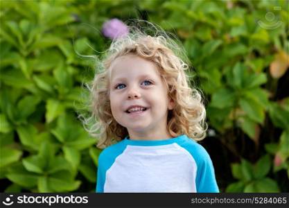 Beautiful boy four year old with long blond hair