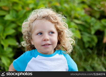 Beautiful boy four year old with long blond hair