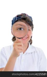 Beautiful boy looking through a magnifying glass isolated on a white background