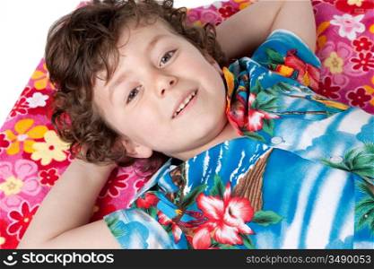 Beautiful boy lying relaxed on the floral towel