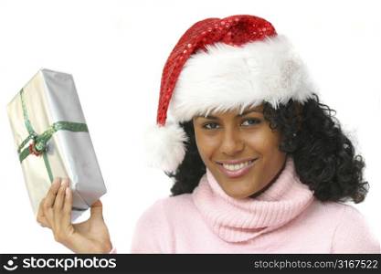 Beautiful brazilian girl holding a christmas present
