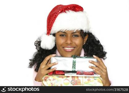 Beautiful brazilian girl holding a stack of christmas presents