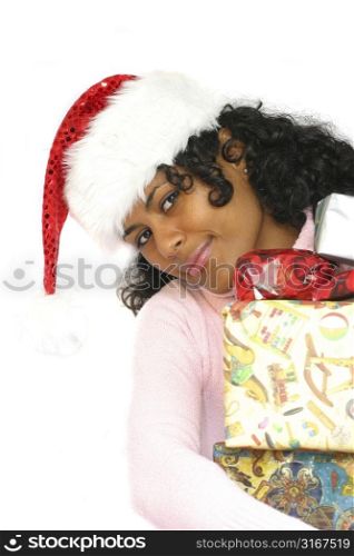 Beautiful brazilian girl holding christmas presents